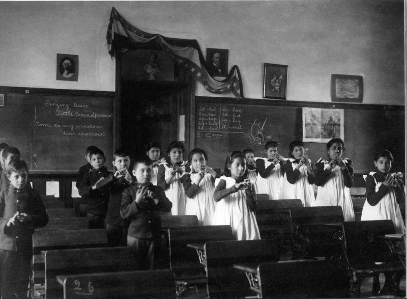 Sioux children practicing lessons 