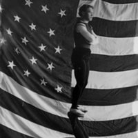 Gymnasts in Front of Flag